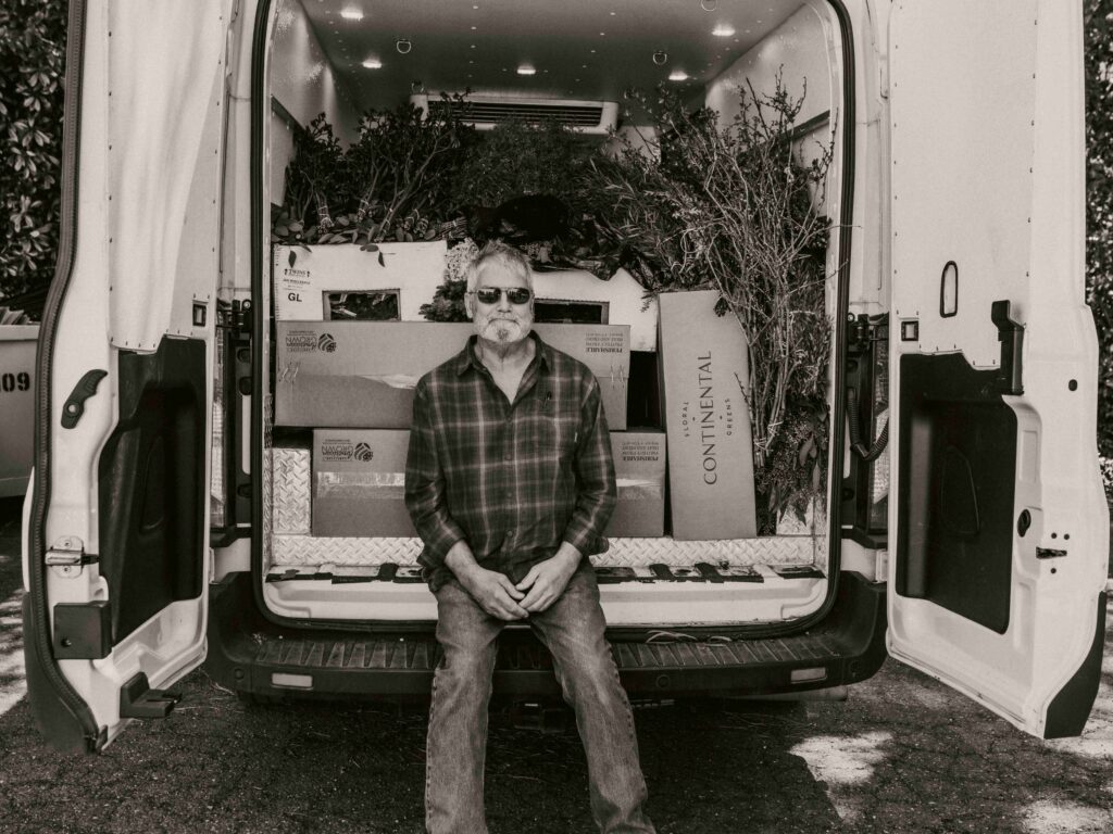J&D Wholesale Flowers owner in back of delivery van